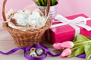 Image showing pink present and colorful tulips festive easter decoration