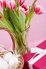 Image showing pink present and colorful tulips festive easter decoration