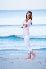 Image showing attractive young blonde woman relaxing on the beach