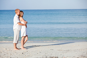 Image showing happy couple in love having fun on the beach