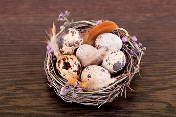 Image showing easter decoration with quail eggs on wood