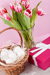 Image showing pink present and colorful tulips festive easter decoration