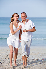 Image showing happy couple in love having fun on the beach