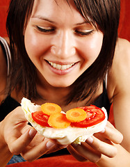 Image showing Woman eating sandwich