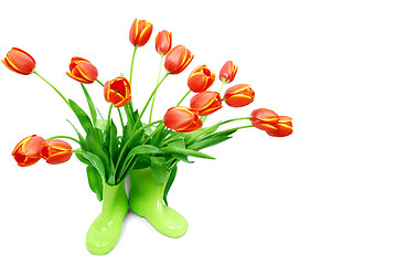 Image showing Fresh tulips in green boots 