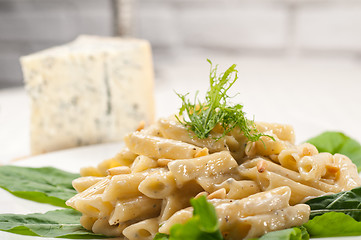 Image showing Italian pasta penne gorgonzola and pine nuts