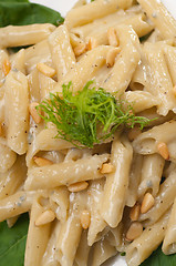 Image showing Italian pasta penne gorgonzola and pine nuts