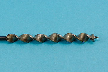 Image showing special thick wood drill bit on blue background 