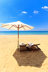 Image showing beds and umbrella on a beach