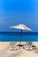 Image showing beds and umbrella on a beach