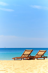 Image showing beds and umbrella on a beach