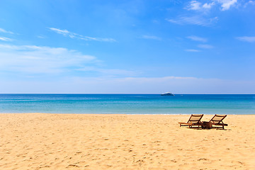 Image showing beds and umbrella on a beach