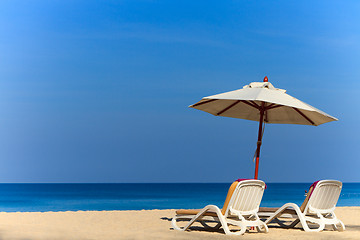 Image showing beds and umbrella on a beach