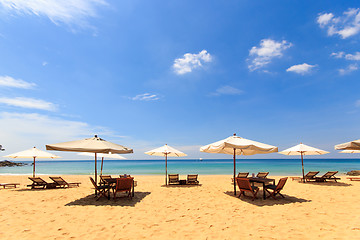 Image showing beds and umbrella on a beach