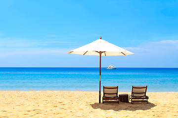 Image showing beds and umbrella on a beach