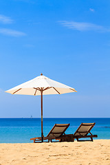 Image showing beds and umbrella on a beach