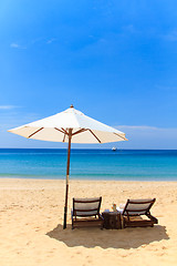 Image showing beds and umbrella on a beach