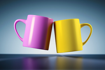 Image showing weightless coffee mugs