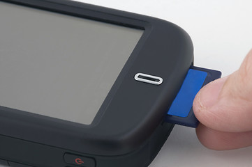 Image showing Man inserts memory card