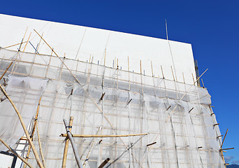 Image showing bamboo scaffolding in construction site 