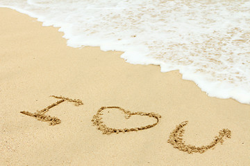Image showing Love message written on the sand