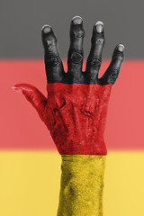 Image showing Old hand with flag, European Union, Germany