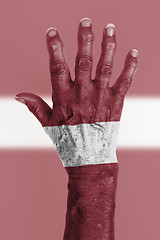 Image showing Old hand with flag, European Union, Latvia