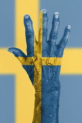 Image showing Old hand with flag, European Union, Sweden