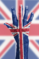 Image showing Old hand with flag, European Union, UK