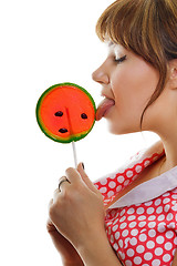 Image showing girl licks a lollipop