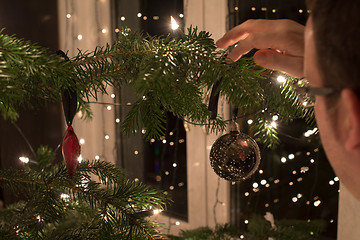 Image showing Decorating The Christmas Tree