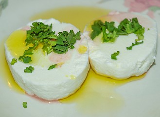 Image showing Tomino cheese with rucola and olive oil