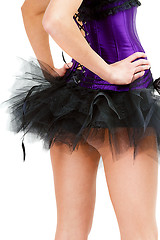 Image showing sexy young girl in a skirt and corset. View from the back