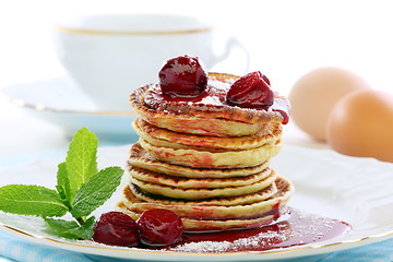 Image showing Pancakes with cherry sauce.