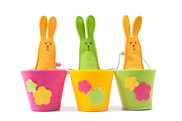 Image showing Multicolored easter bunnies sitting in row