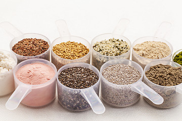 Image showing scoops of seeds and powders
