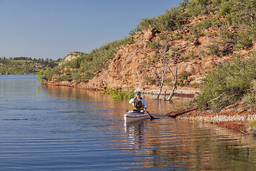 Image showing canoe paddler on a mountain lake