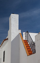 Image showing Detail of white house under blue sky 