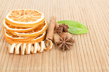 Image showing Star Anise, cinnamon and dried orange wooden background 