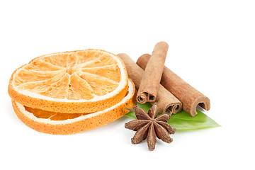 Image showing Star Anise, cinnamon and dried orange and green leave on white