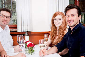 Image showing smiling happy people in restaurant