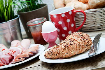 Image showing traditional french breakfast on table in morning