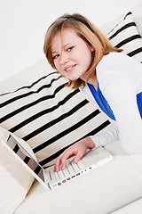 Image showing young teenager girl with laptop smilig