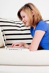 Image showing young teenager girl with laptop smilig