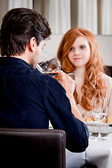 Image showing couple drinking red wine in restaurant