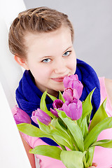 Image showing smiling teenager girl with pink tulips bouquet 