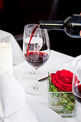 Image showing couple drinking red wine in restaurant