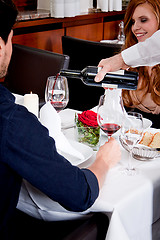 Image showing couple drinking red wine in restaurant