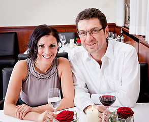 Image showing smiling happy people in restaurant