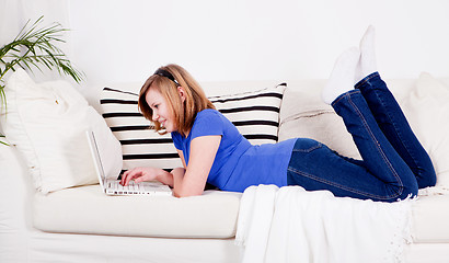 Image showing young teenager girl with laptop smilig